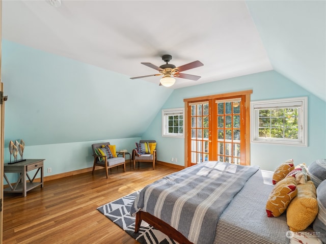 bedroom featuring ceiling fan, vaulted ceiling, hardwood / wood-style floors, and access to outside