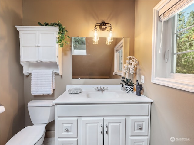 bathroom with vanity and toilet