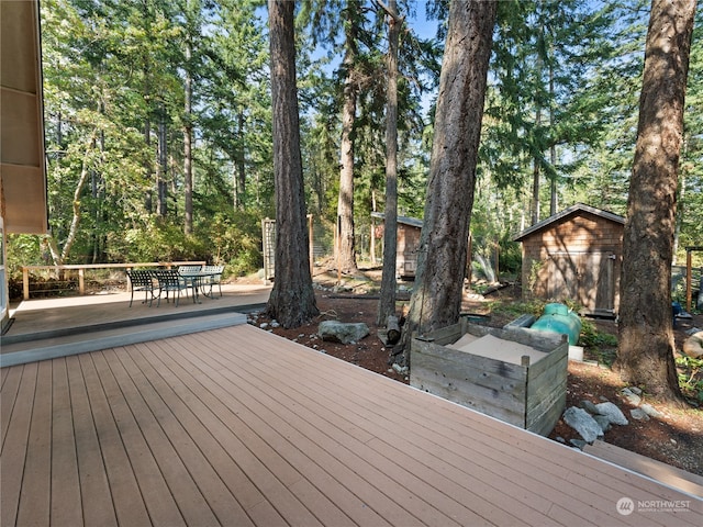 wooden deck with a shed