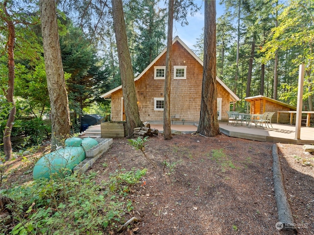 exterior space featuring a patio and a wooden deck