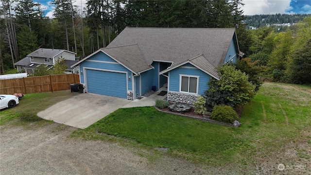 view of front facade with a garage and a front lawn