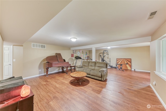 living room with light hardwood / wood-style flooring