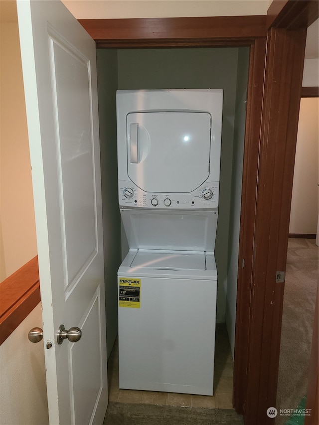 laundry area with stacked washer / dryer