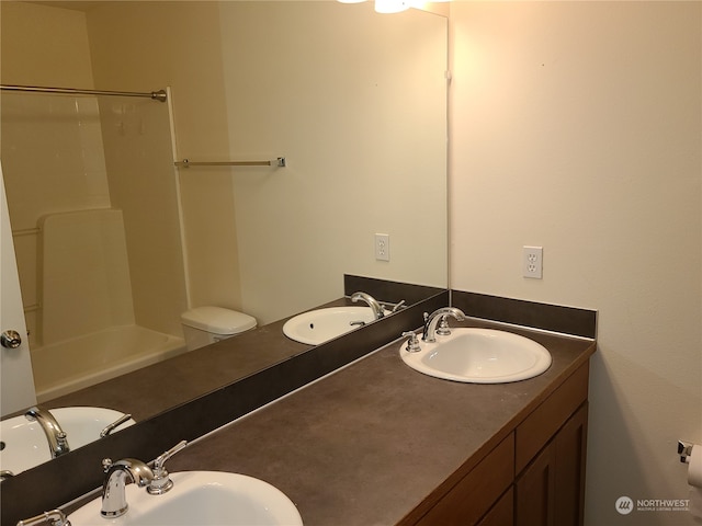 full bathroom with  shower combination, vanity, and toilet