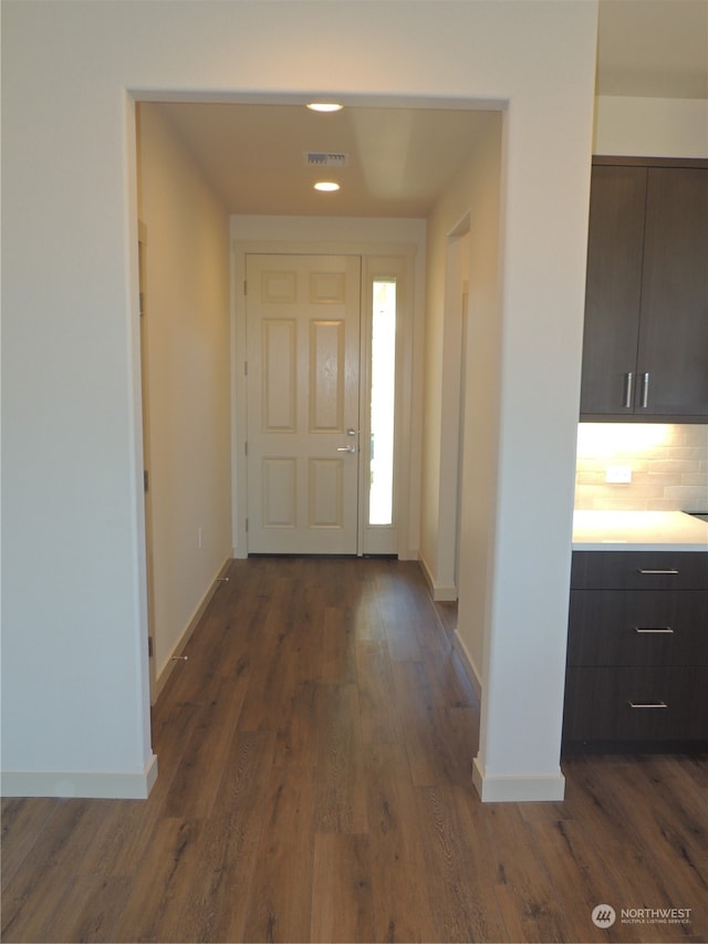 foyer with dark hardwood / wood-style floors