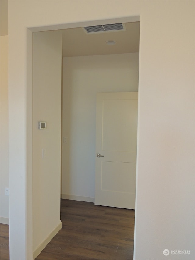 hall featuring dark wood-type flooring