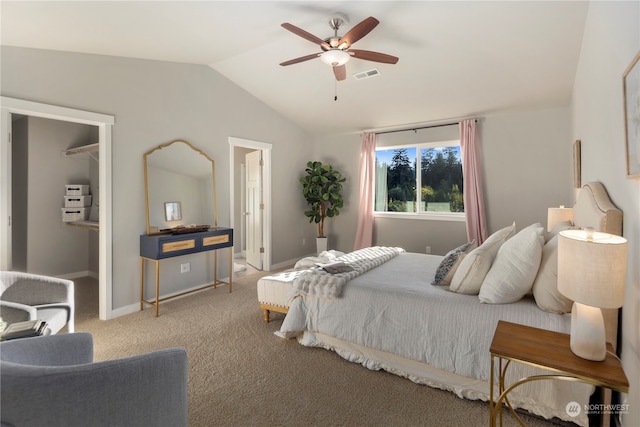 bedroom featuring vaulted ceiling, light carpet, and ceiling fan