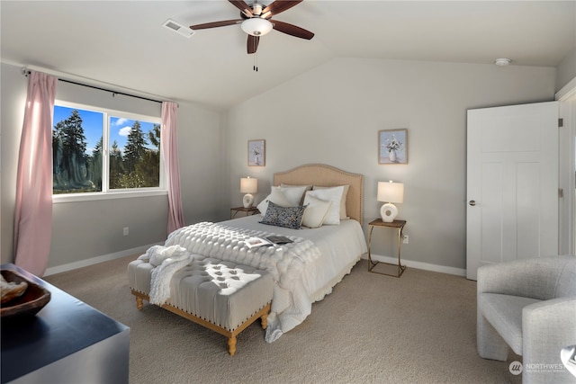 carpeted bedroom with vaulted ceiling and ceiling fan