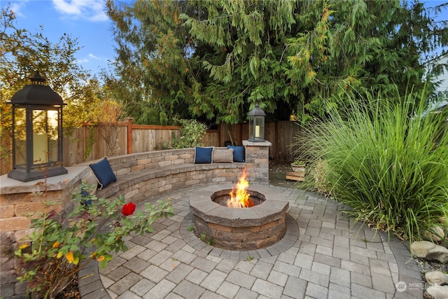 view of patio featuring an outdoor fire pit