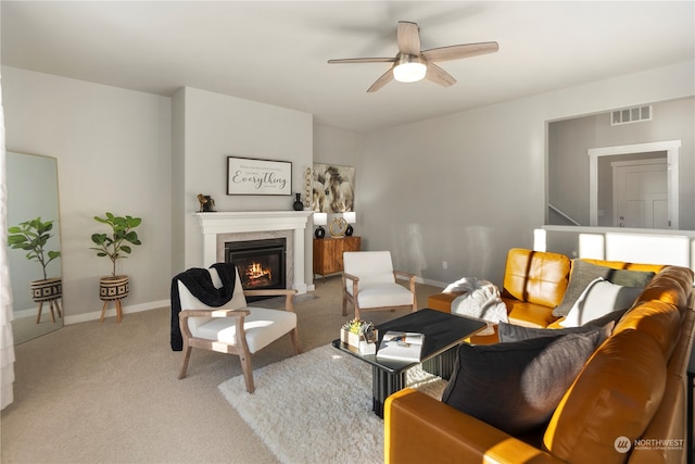 living room with ceiling fan and light carpet