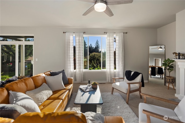 carpeted living room featuring ceiling fan