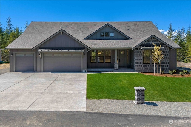 craftsman-style house with a front yard and a garage