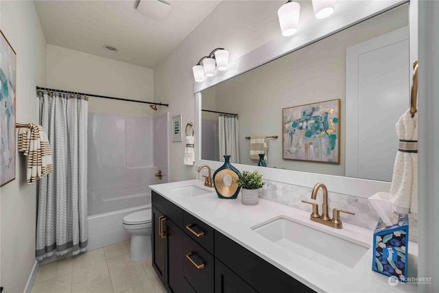 full bathroom with shower / bath combination with curtain, tile patterned floors, vanity, and toilet