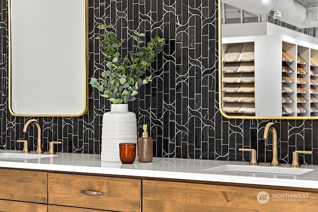 kitchen featuring sink and tasteful backsplash