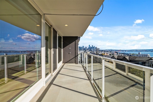 balcony featuring a water view