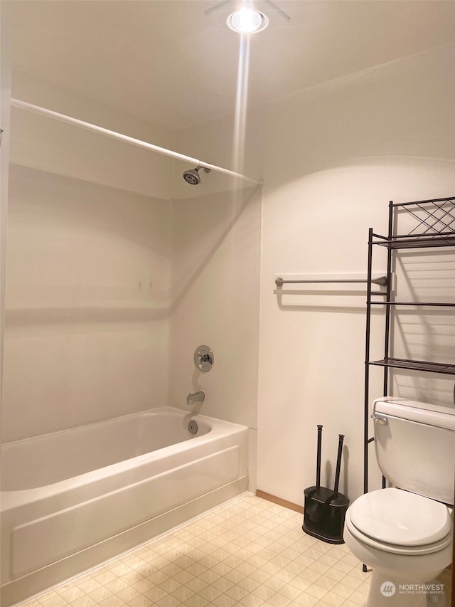 bathroom with toilet and shower / bath combination