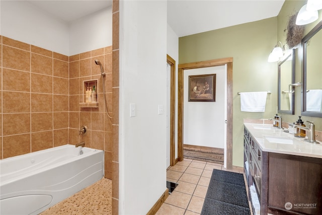 bathroom featuring vanity, tiled shower / bath combo, and tile patterned floors