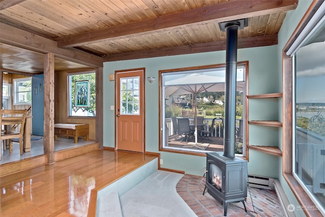 3224 SW Scenic Heights St, Oak Harbor, WA 98277 - foyer featuring a wood stove, wood ceiling with exposed beams, baseboard heating, healthy amount of natural light, and baseboards