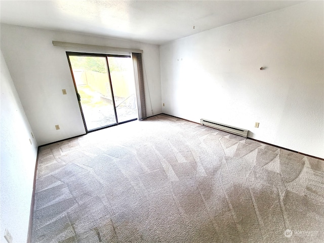 carpeted empty room with baseboard heating