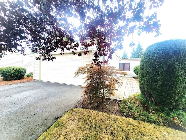 view of side of property with a garage