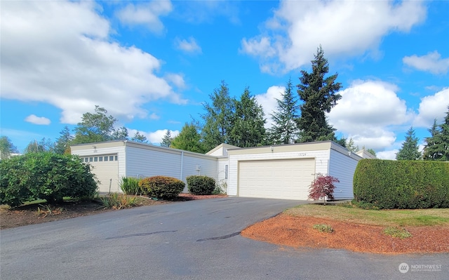 view of side of home featuring a garage