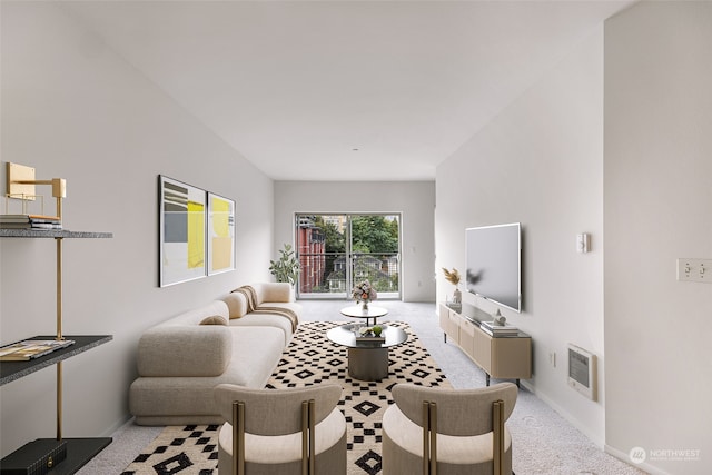 carpeted living room featuring heating unit