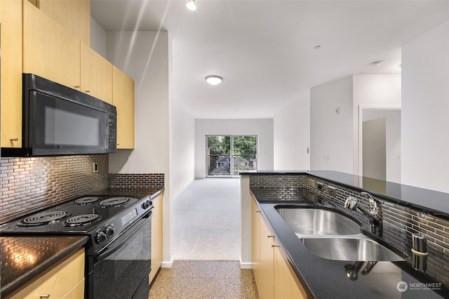 kitchen featuring light brown cabinetry, sink, decorative backsplash, and black appliances