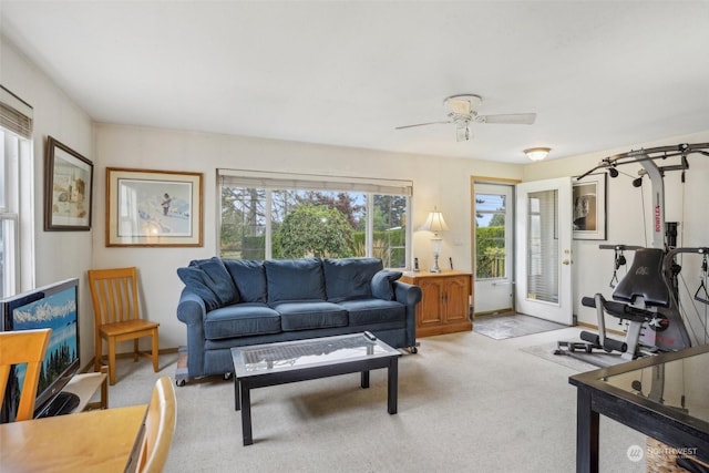 6439 S Clement Ave, Tacoma, WA 98409 - living area featuring a ceiling fan and light carpet