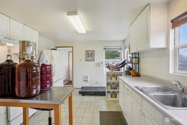 6439 S Clement Ave, Tacoma, WA 98409 - kitchen with white cabinetry, plenty of natural light, and a sink