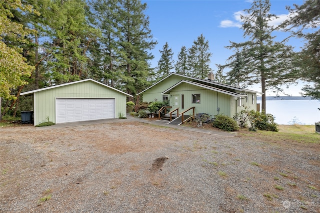 view of home's exterior with a garage and an outdoor structure