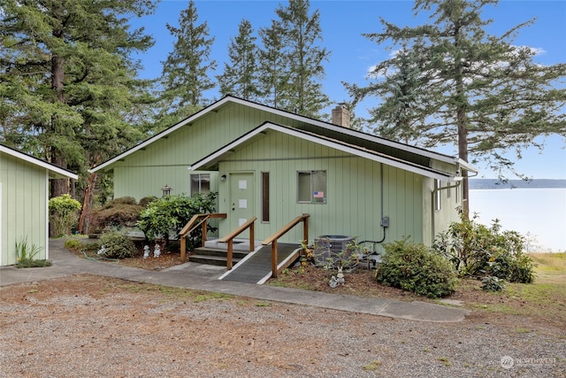 rear view of property featuring central air condition unit