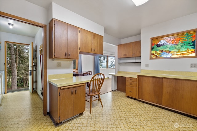 kitchen with built in desk and kitchen peninsula