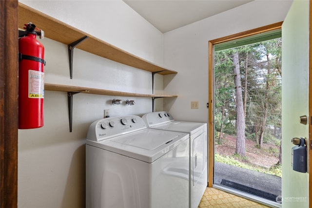 laundry room featuring washing machine and clothes dryer