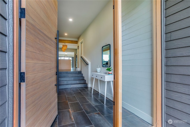 interior space featuring wooden walls