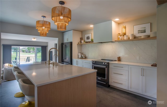 kitchen with decorative backsplash, white cabinetry, range with electric stovetop, pendant lighting, and high end fridge