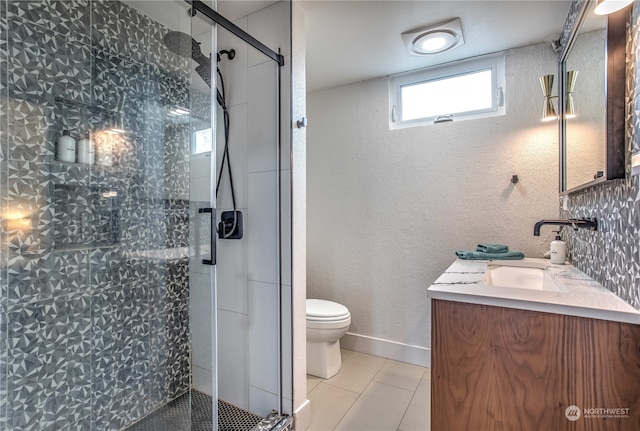 bathroom with vanity, tasteful backsplash, an enclosed shower, tile patterned floors, and toilet