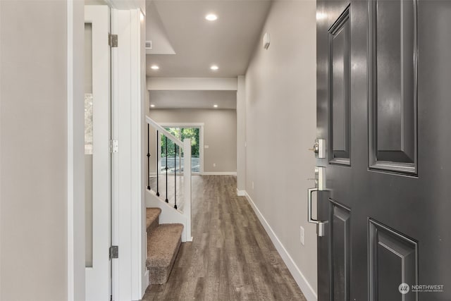 corridor featuring dark hardwood / wood-style floors