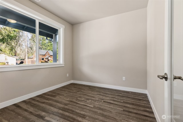 empty room with dark hardwood / wood-style floors