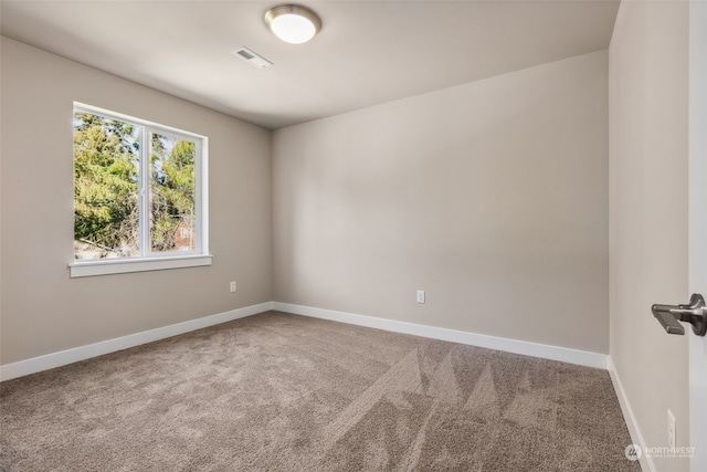 spare room featuring carpet