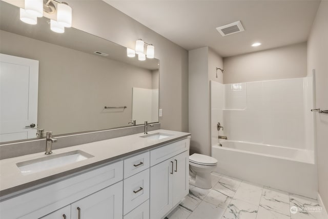 full bathroom with tub / shower combination, vanity, and toilet