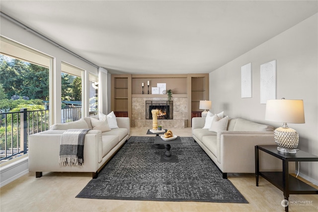 living room with light colored carpet and a fireplace