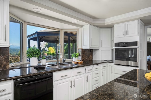 kitchen with white cabinets, black dishwasher, stainless steel oven, and sink