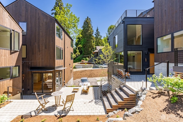 view of home's community featuring a patio area