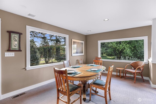 view of carpeted dining area