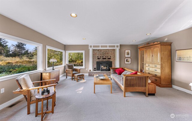 carpeted living room with a fireplace