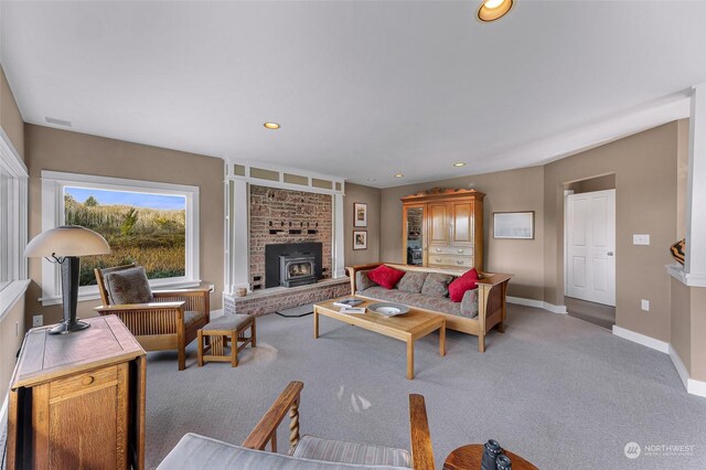 living room with light colored carpet and a brick fireplace