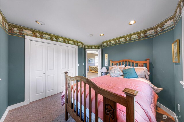 carpeted bedroom with a closet