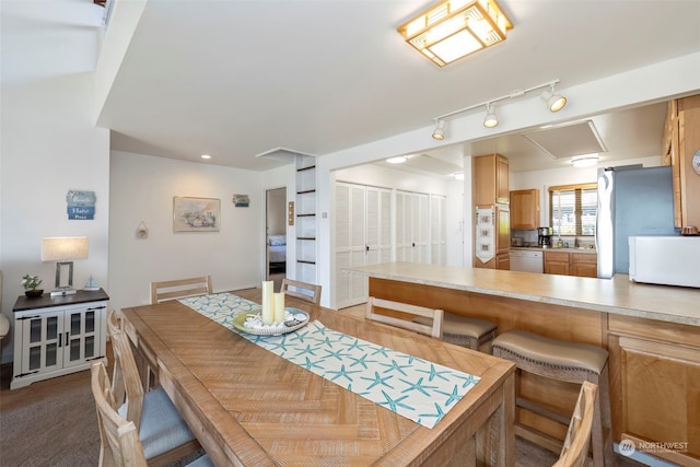 dining area featuring carpet