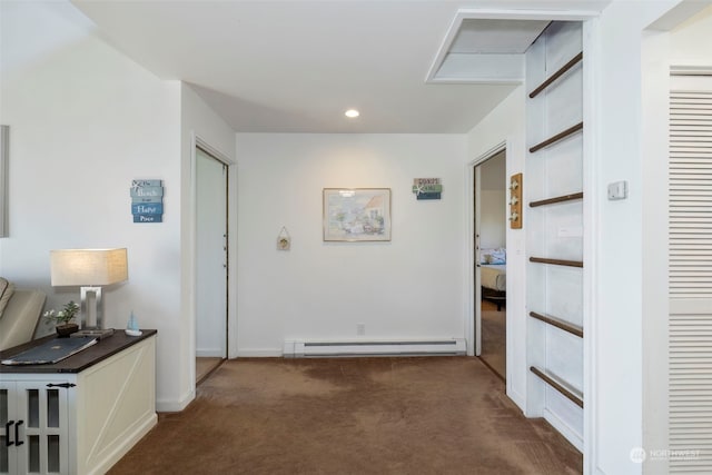 hallway featuring a baseboard radiator and dark carpet