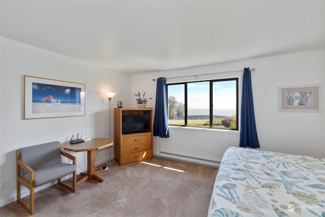 carpeted bedroom with a baseboard radiator